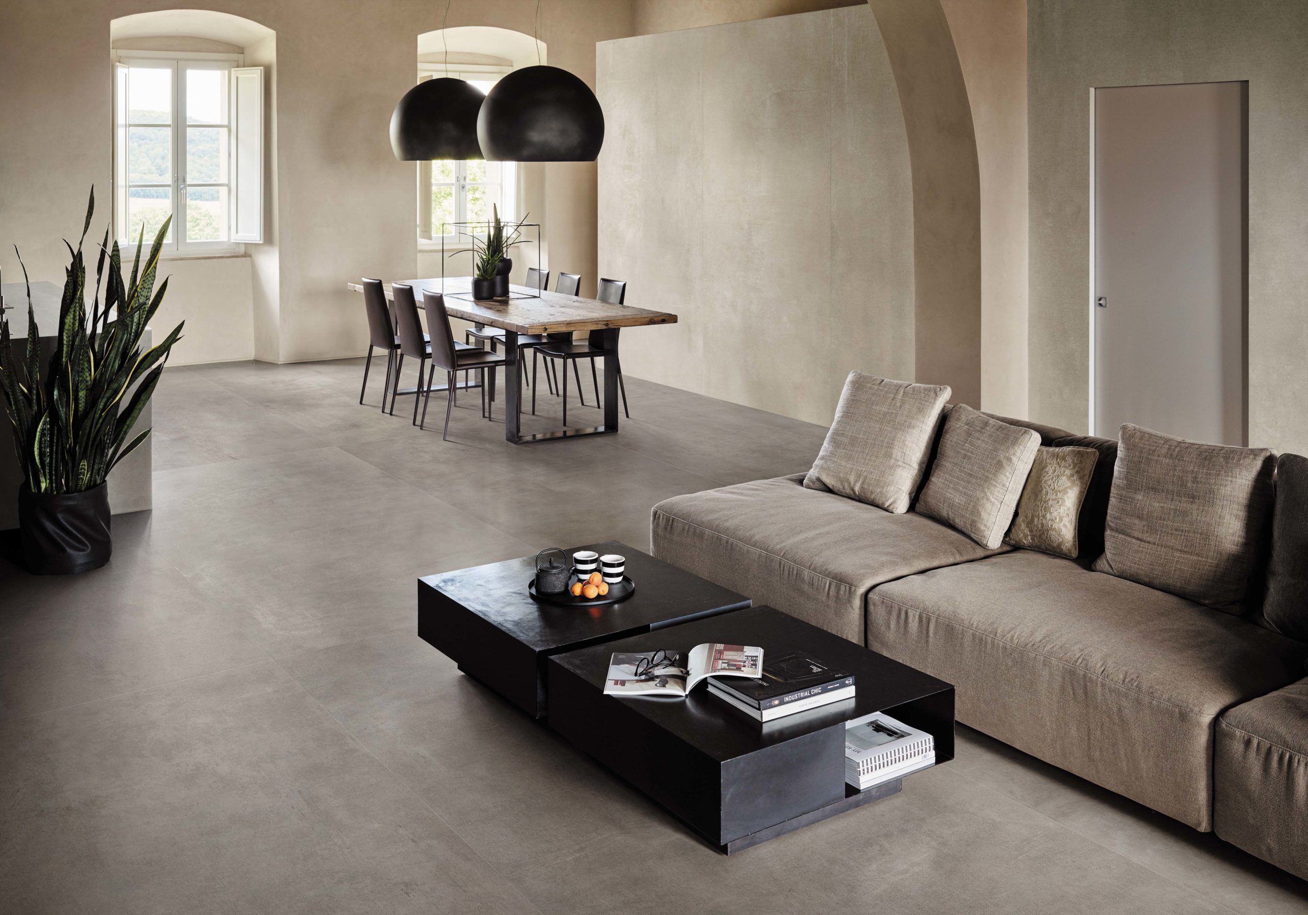 Boost porcelain tile in grey and white installed on the floor in a living area.