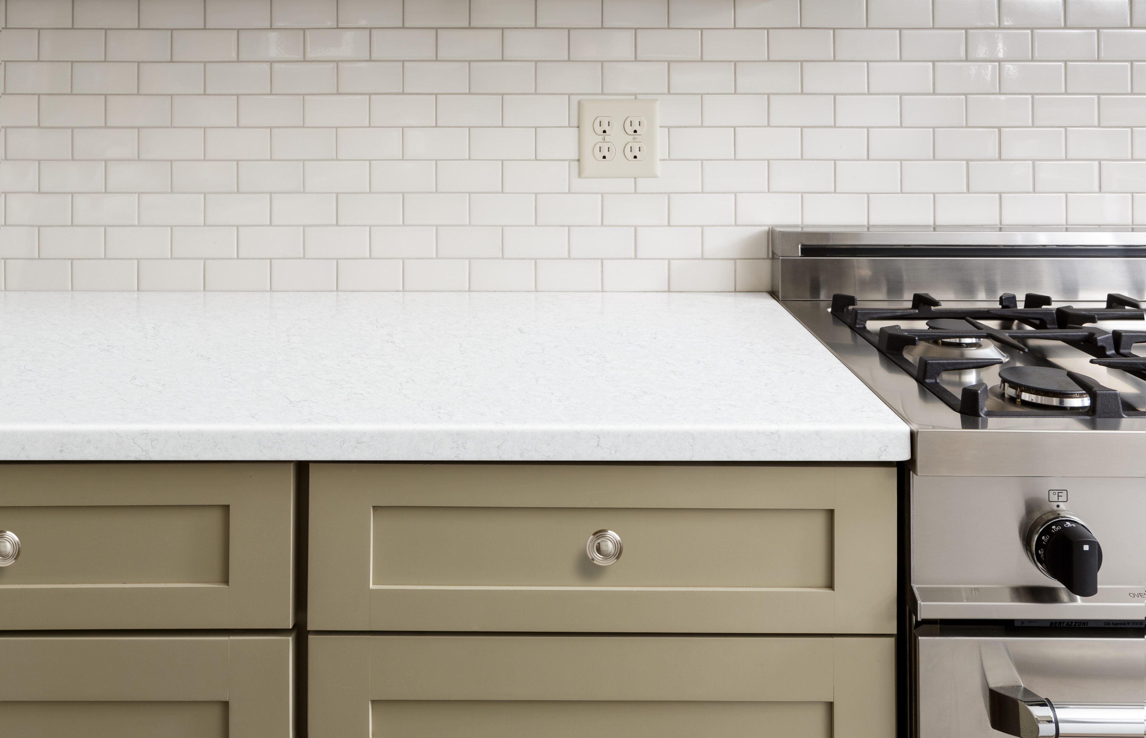 Kitchen Install of Birchwood from MetroQuartz and olive green cabinets