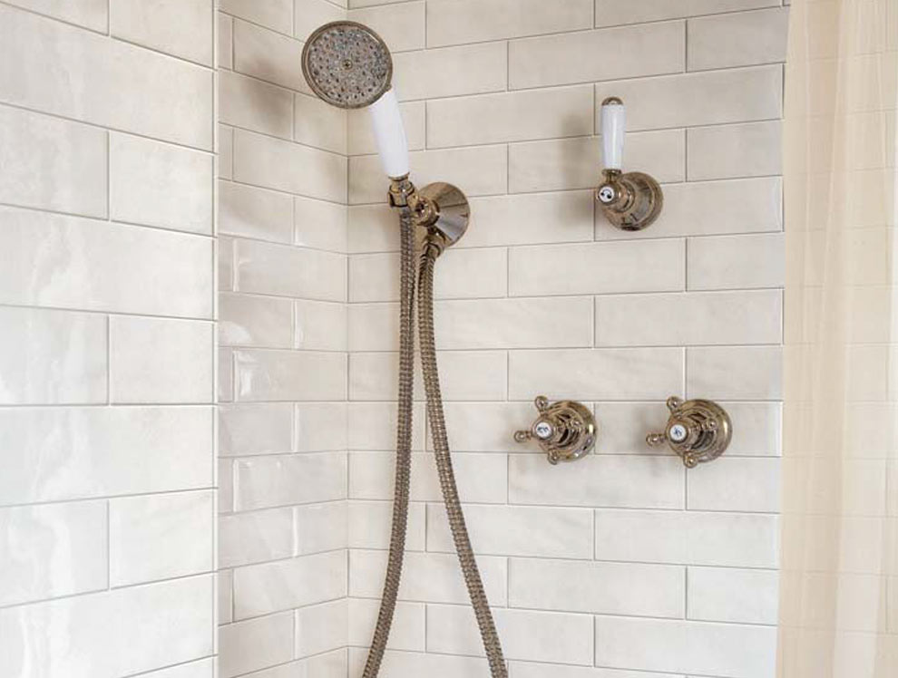 Gesso Boston porcelain tile installed on walls of traditional bathroom in shower