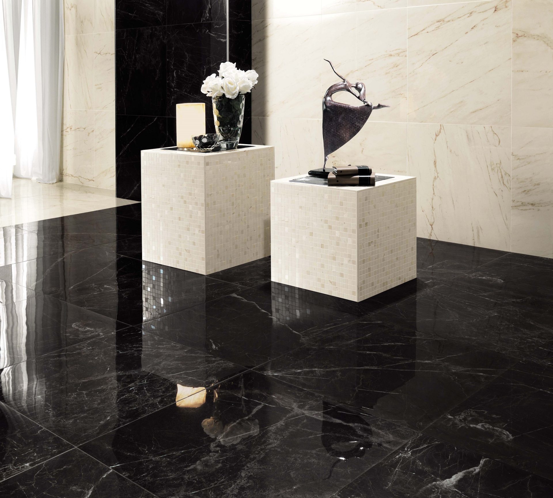 Marvel Pro Noir St. Laurent on floors and column and Statuario Select tile on walls in office building