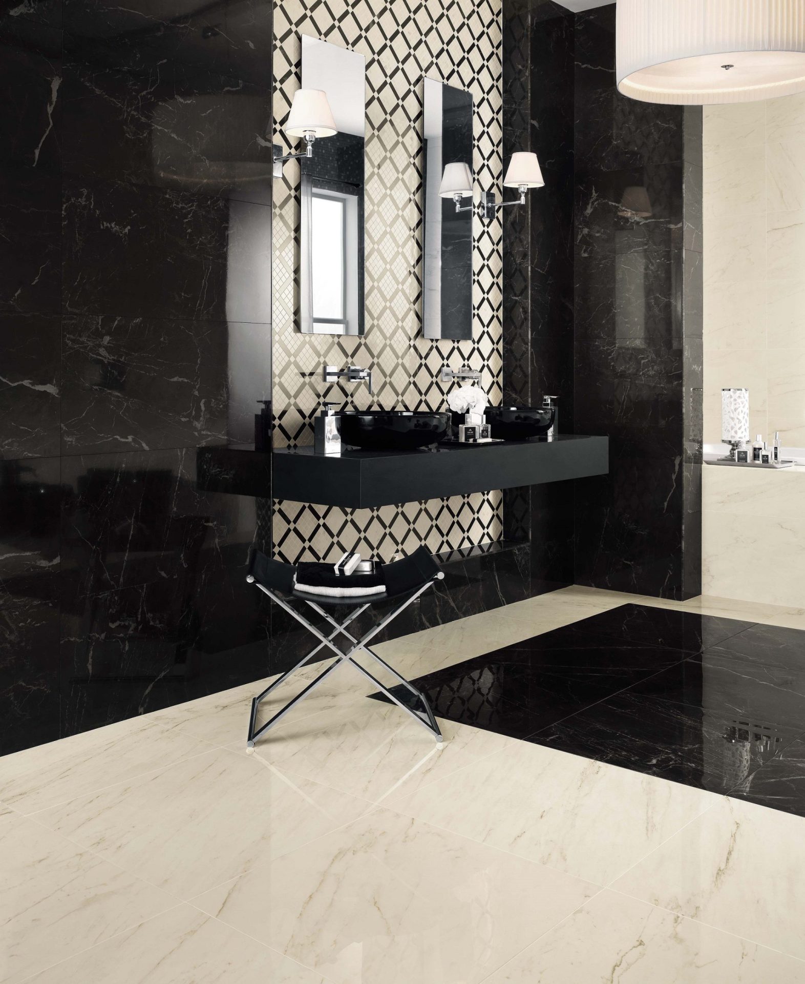 Marvel Pro Statuario Select tile on floors and Noir St. Laurent tile on walls and area of floor under sink in public bathroom