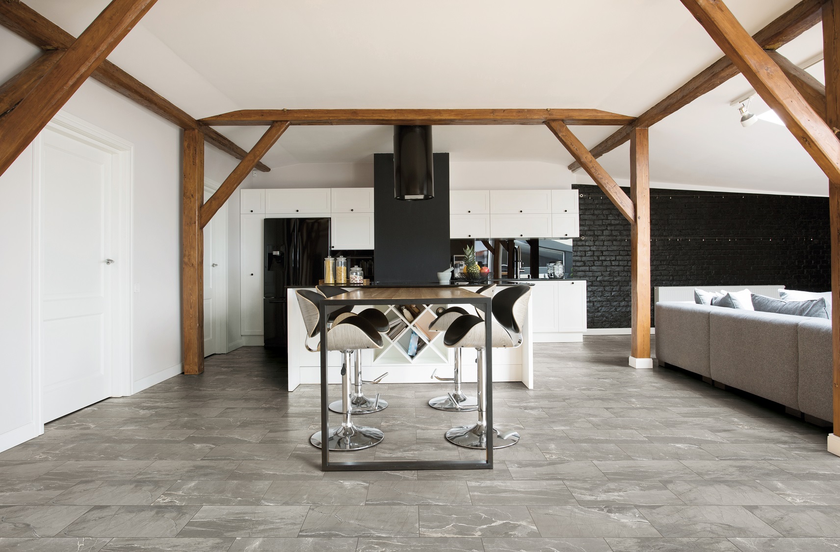 Dark Grey Absolute porcelain tile on the floor in a modern dining area.