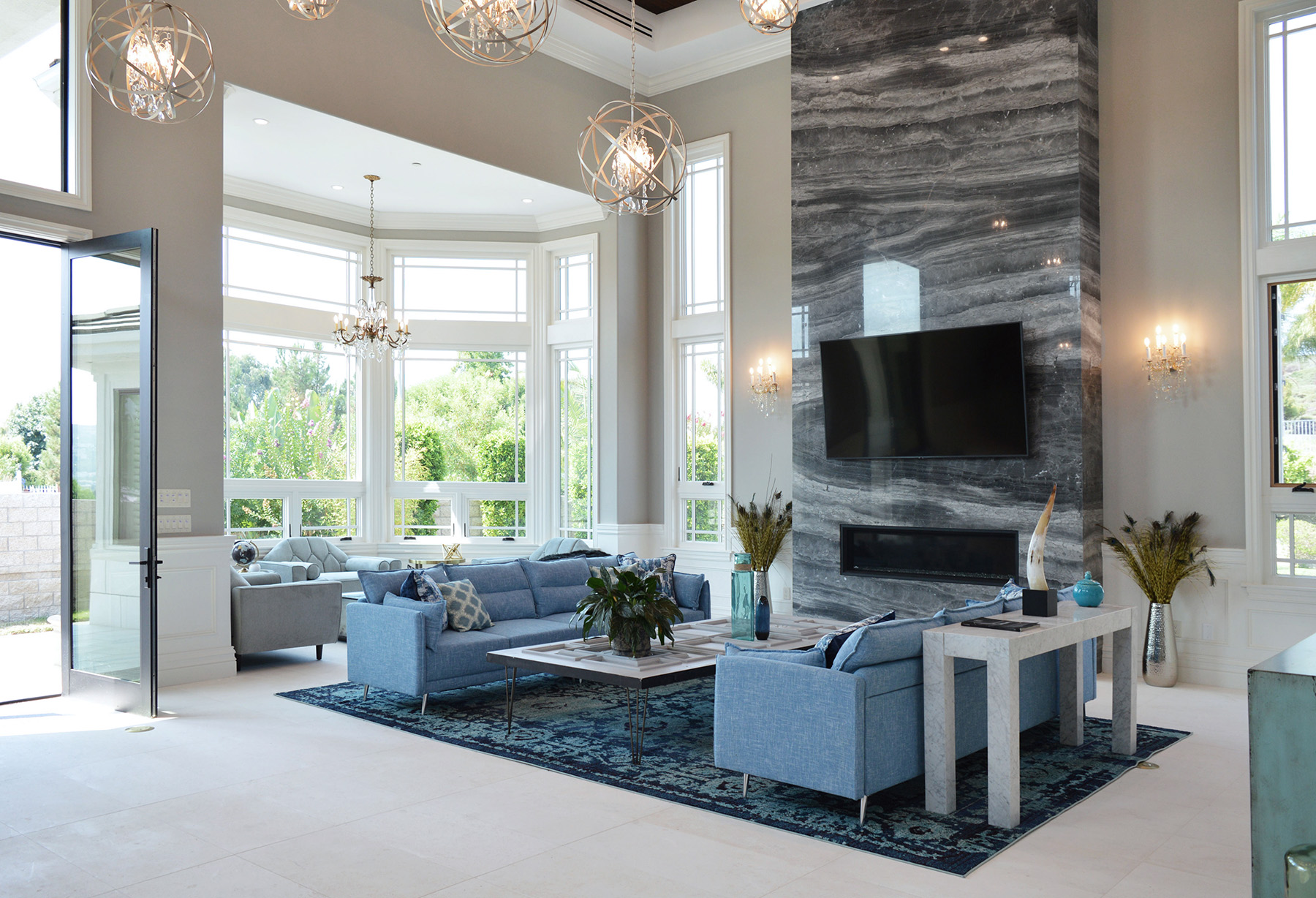 Silver Fantasy marble featured in modern living room with blue furnishings