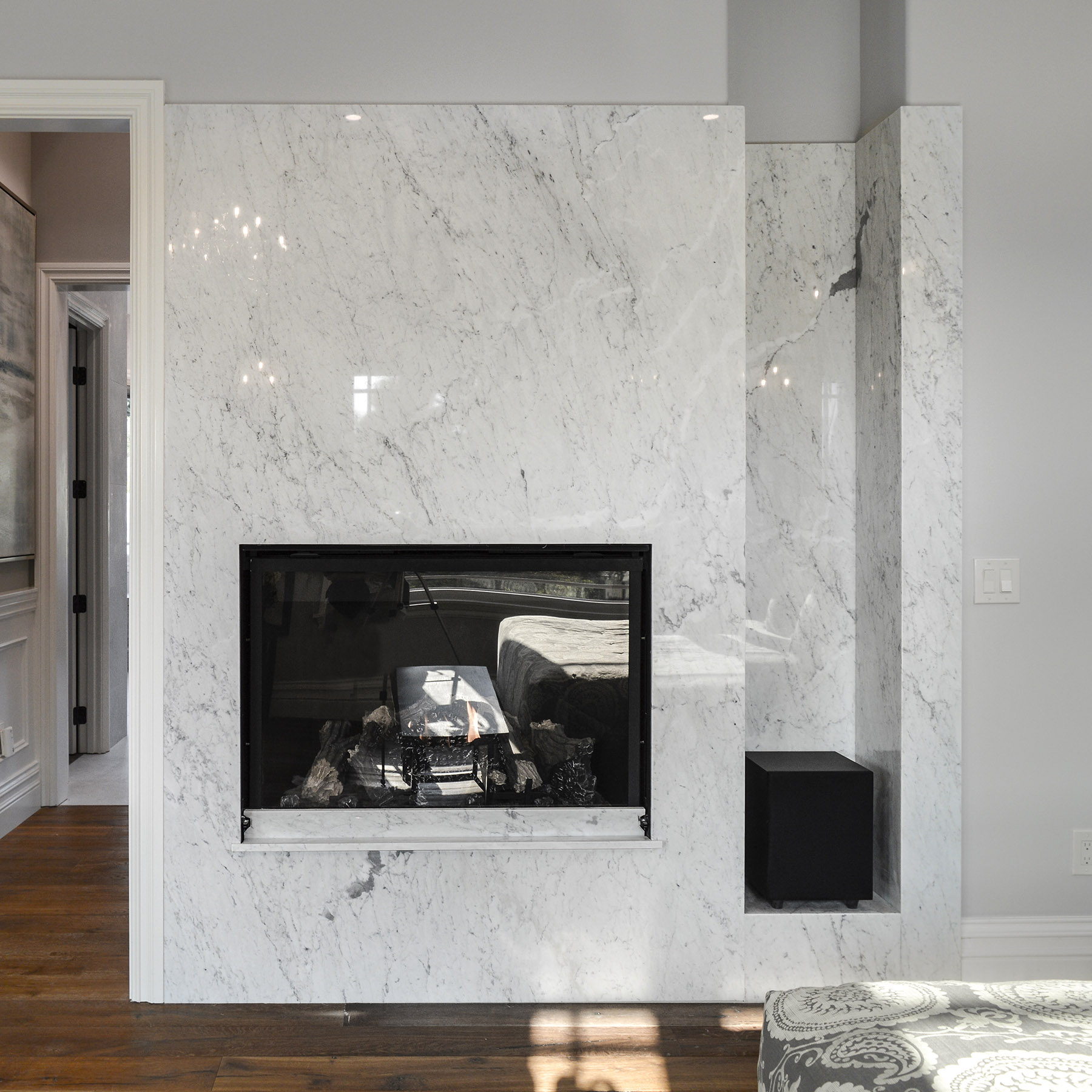 Carrara marble installed on bedroom fireplace