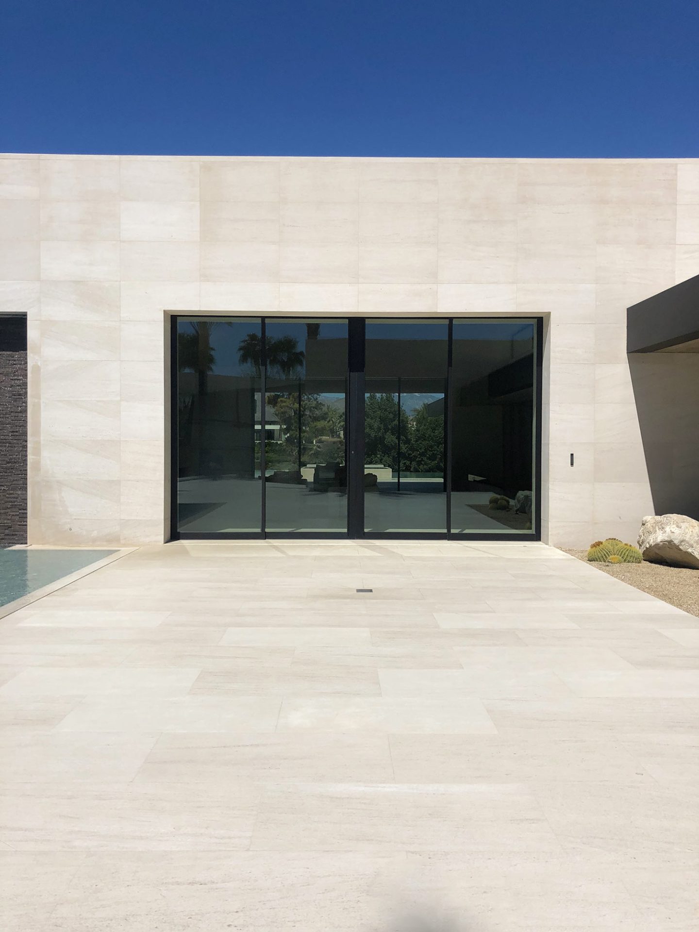 Mocca Cream Medium limestone tiles featured in exterior entryway