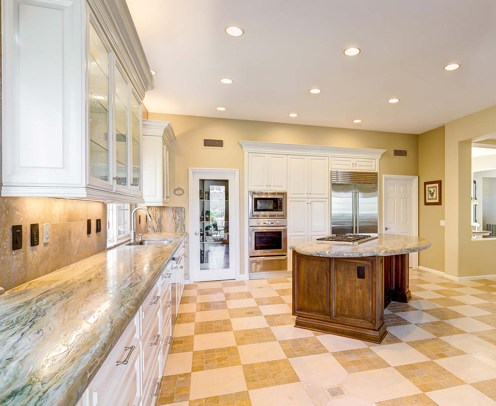 Fusion granite featured in modern kitchen with checkered flooring
