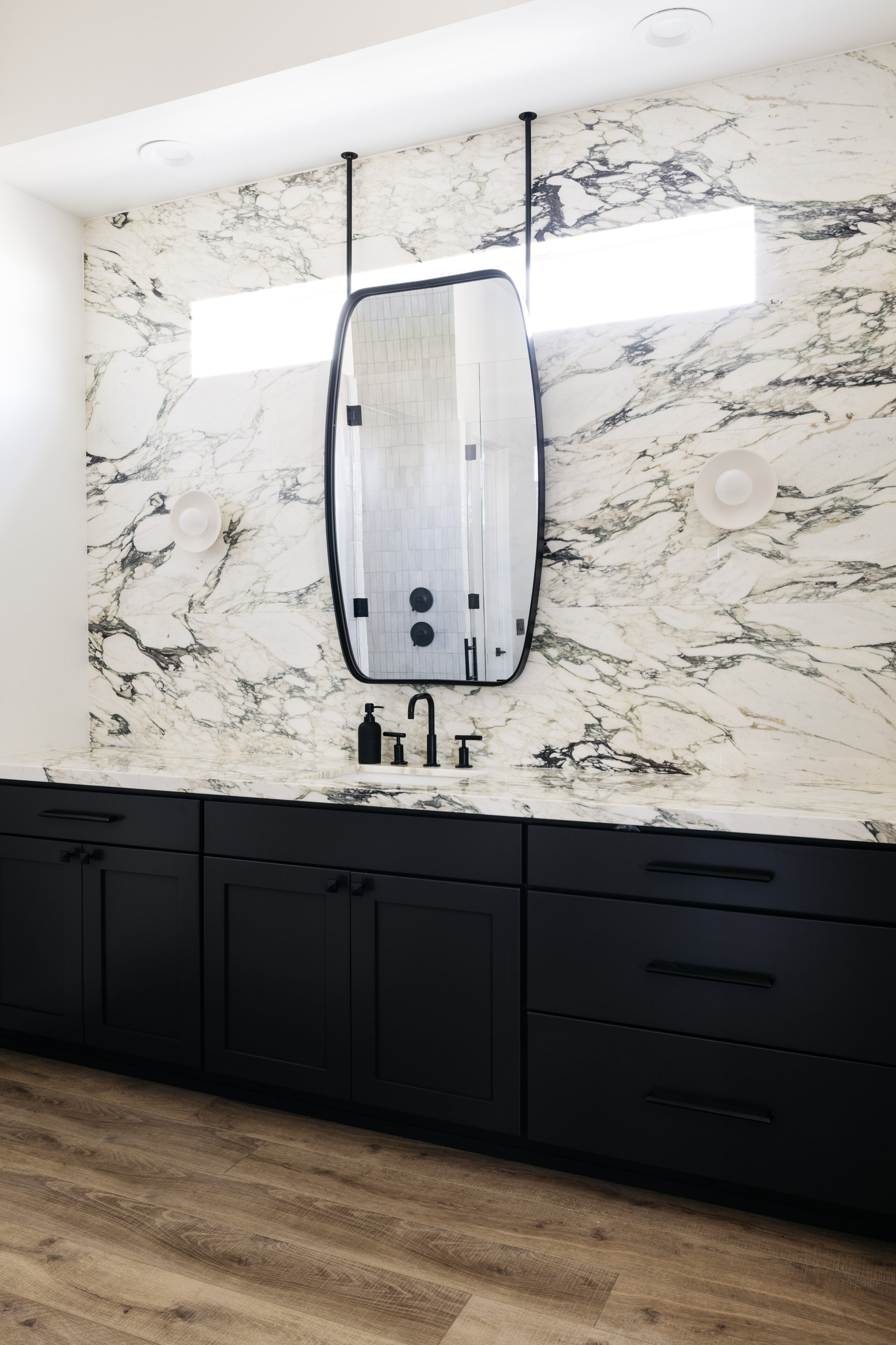 Calacatta Paonazzo bathroom countertops with marble wall backsplash