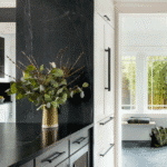 Soapstone countertops in an historic but renovated kitchen. white cabinetry.