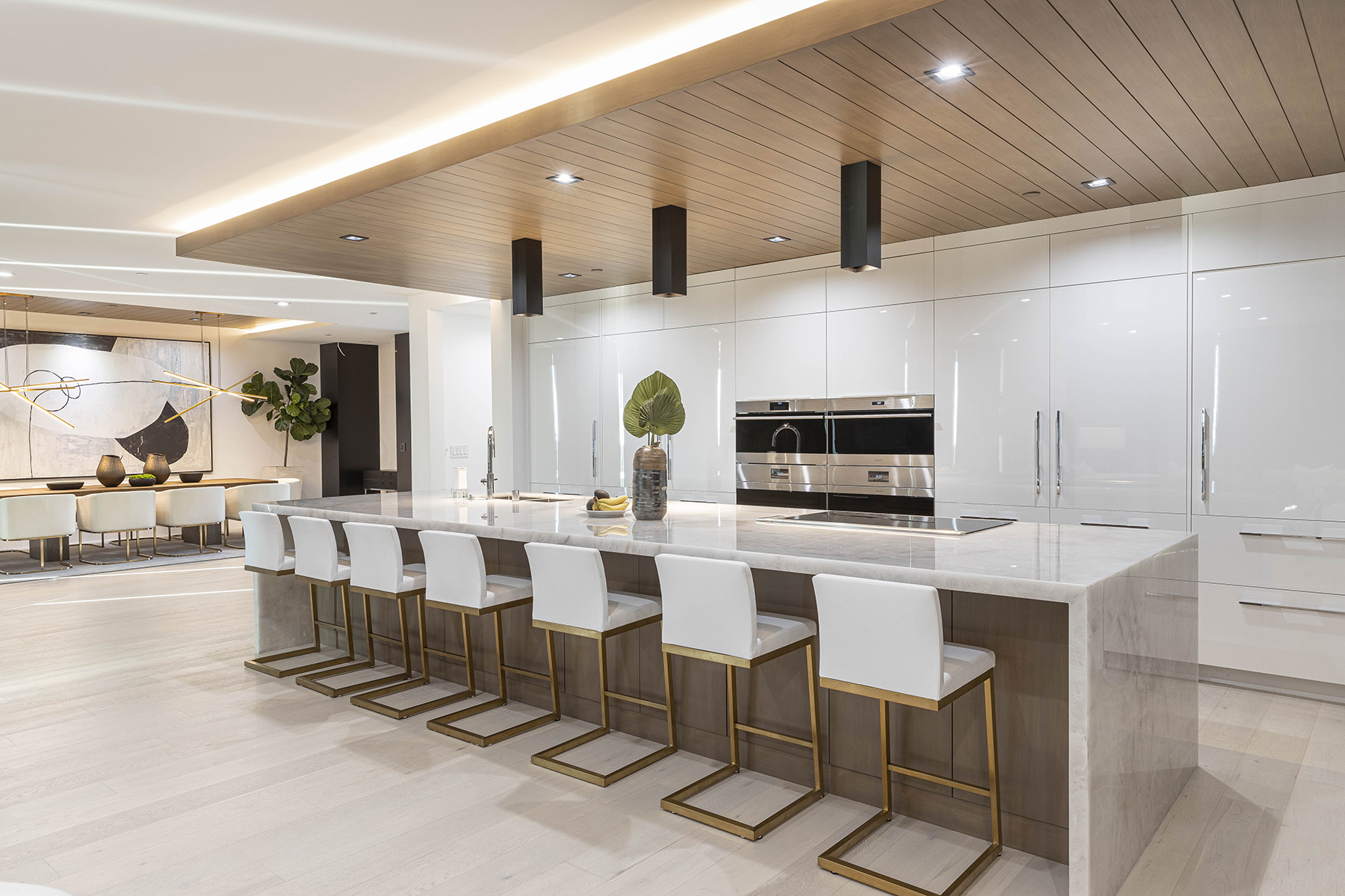 Lumix Cristallo quartzite featured in modern kitchen with white cabinets