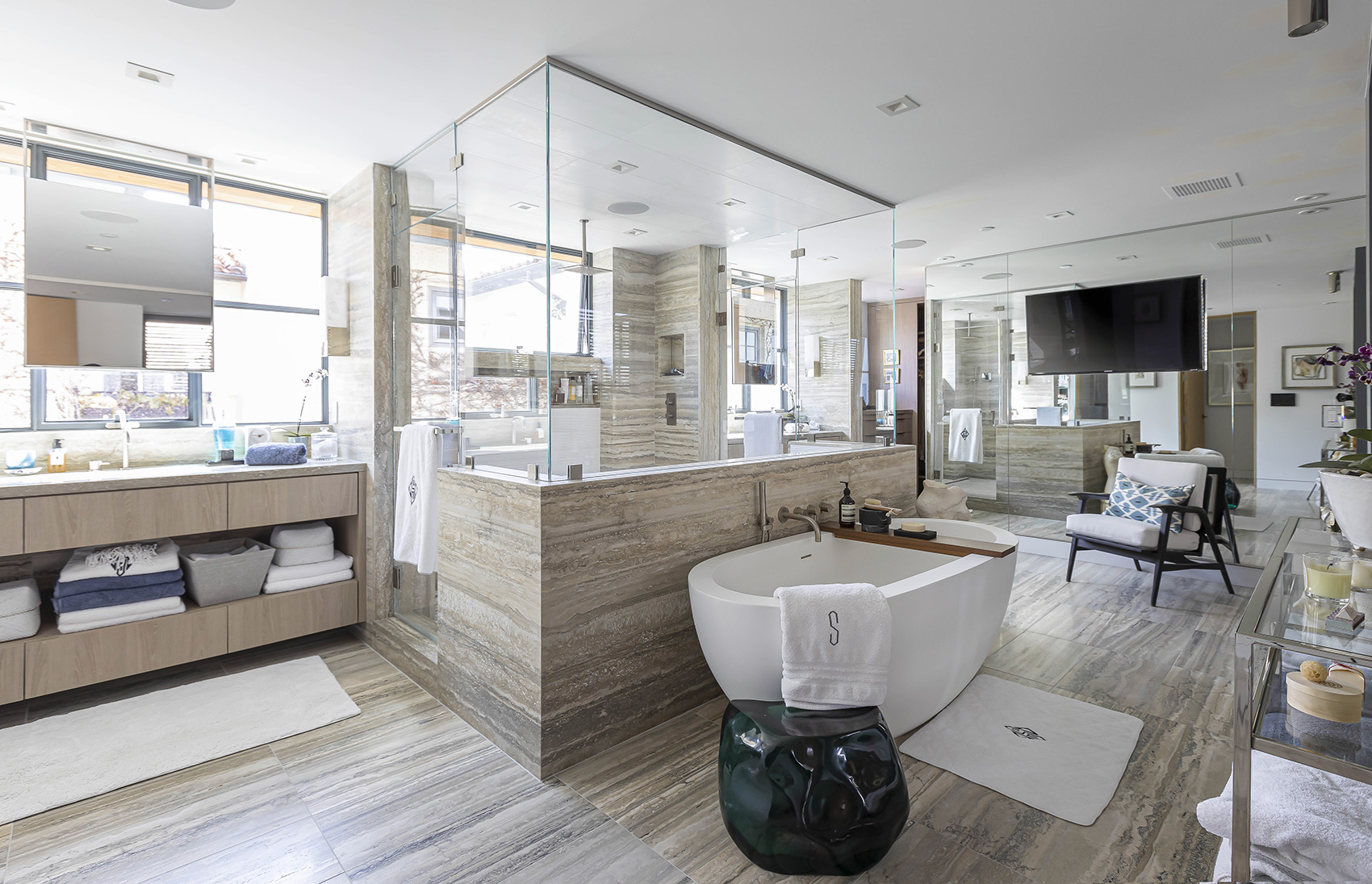 Tuscany Silver travertine featured in modern bathroom with beige cabinets