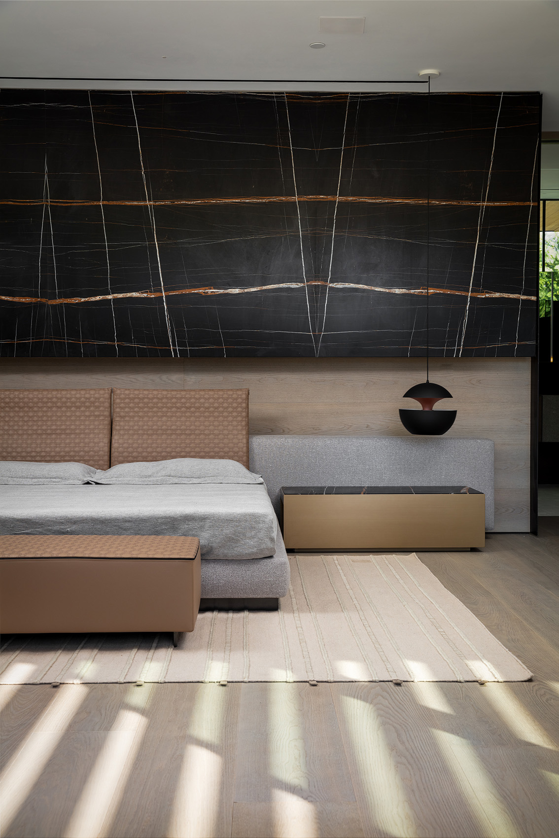 Noir St. Laurent marble featured in bedroom with grey bed