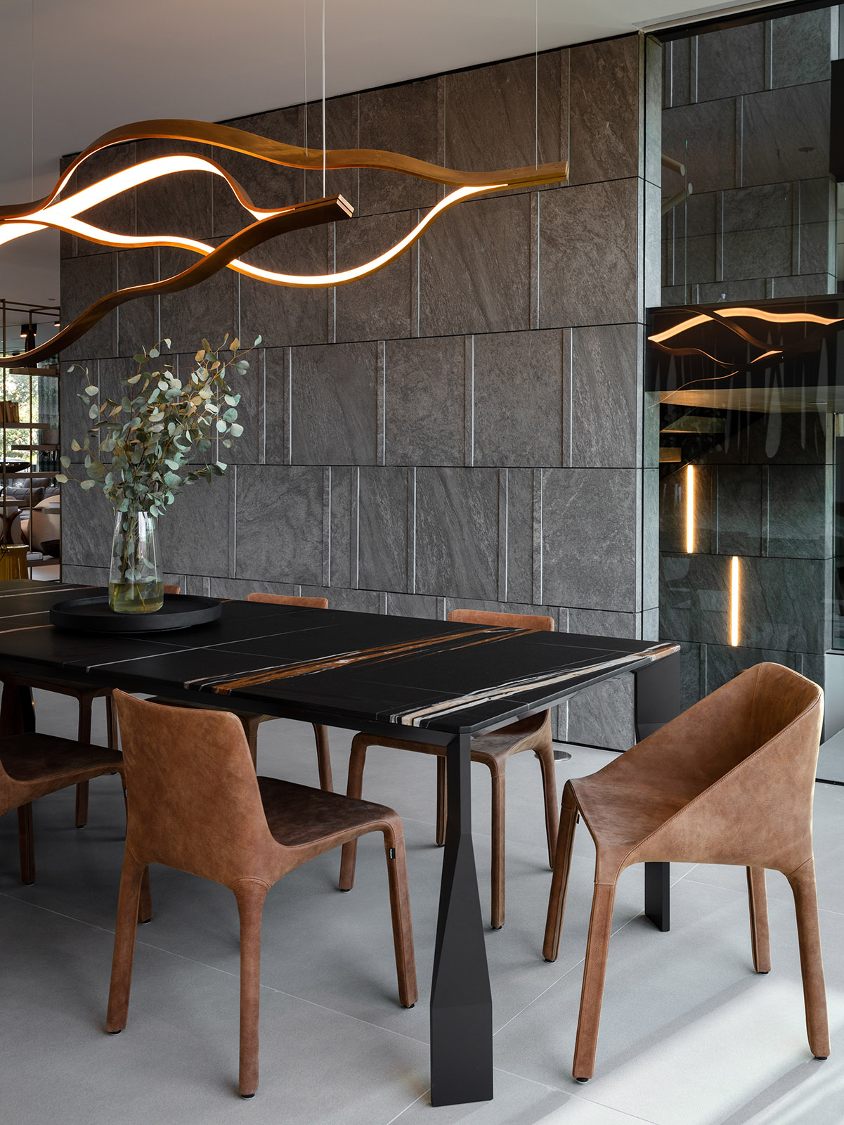 Noir St. Laurent marble featured in modern living room with brown chairs
