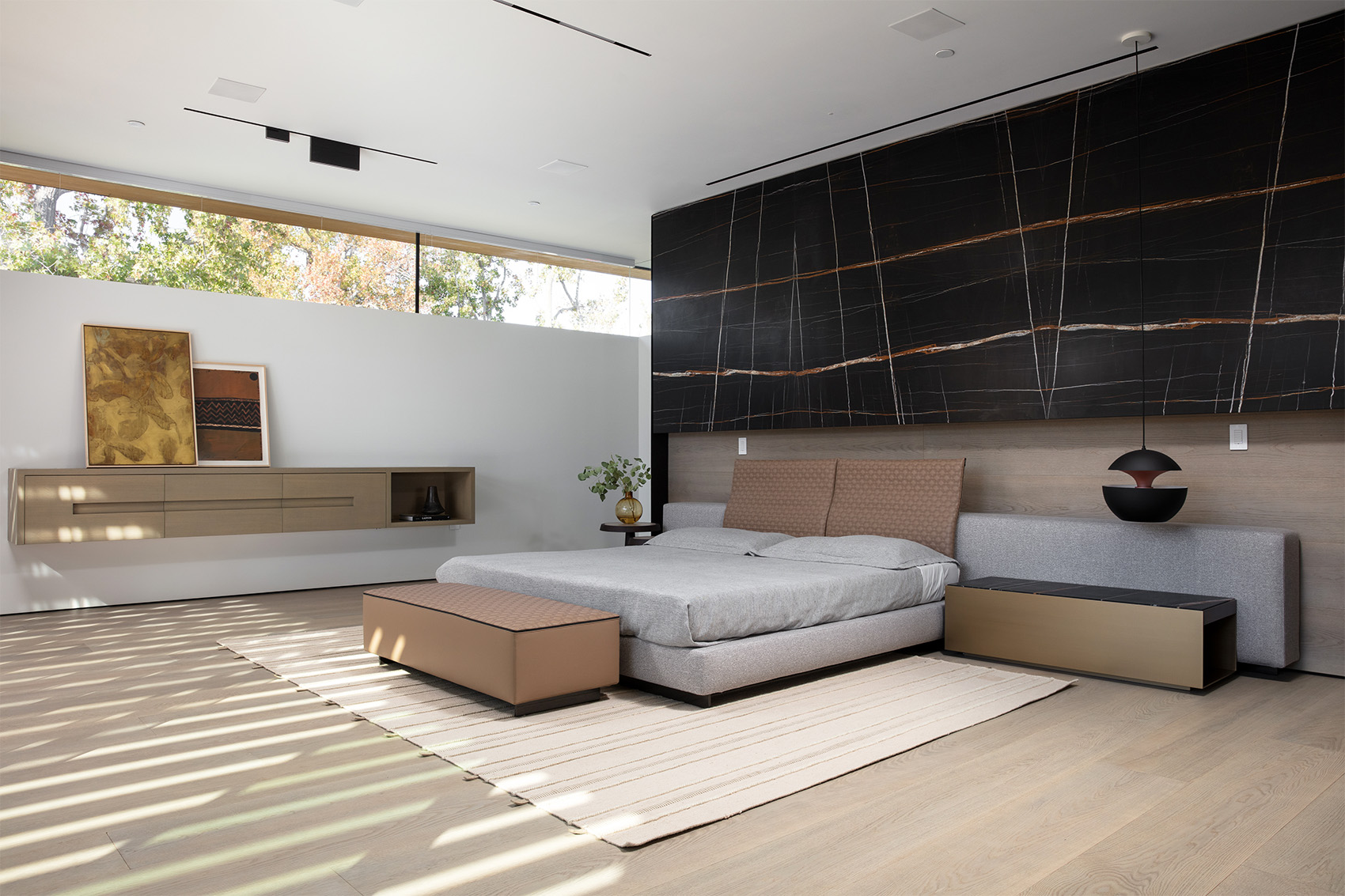 Noir St. Laurent marble featured in modern bedroom with beige furnishings