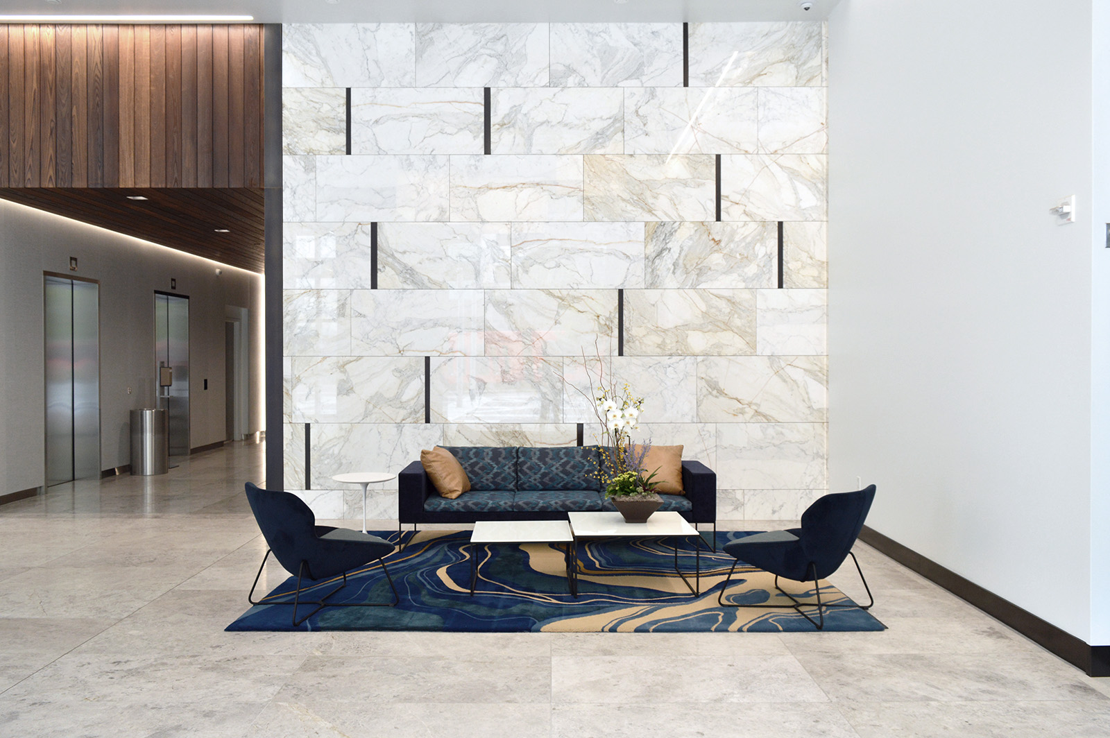 Calacatta Borghini marble featured in commercial space with blue furniture
