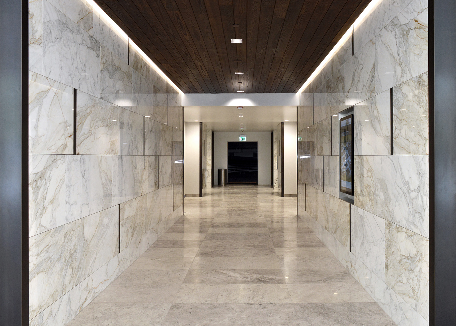 Calacatta Borghini installed on hallway walls inside commercial building