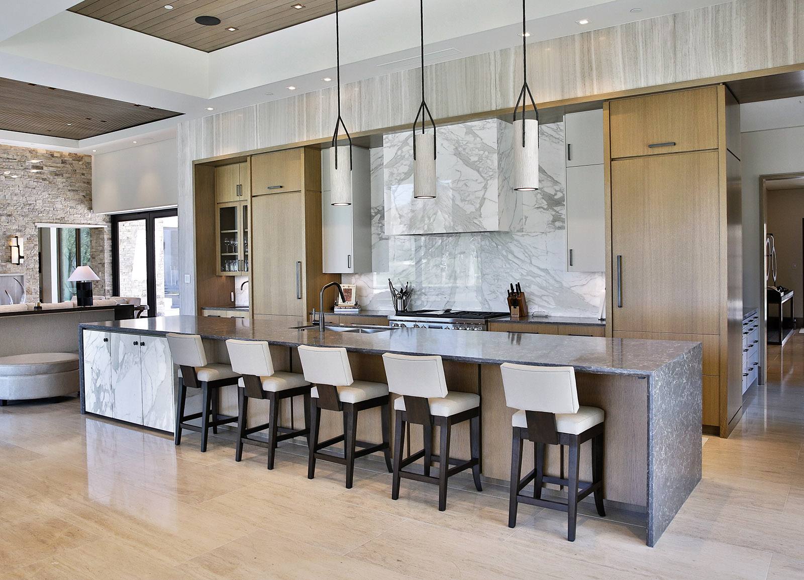 Calacatta Gold marble featured in modern kitchen with beige cabinets
