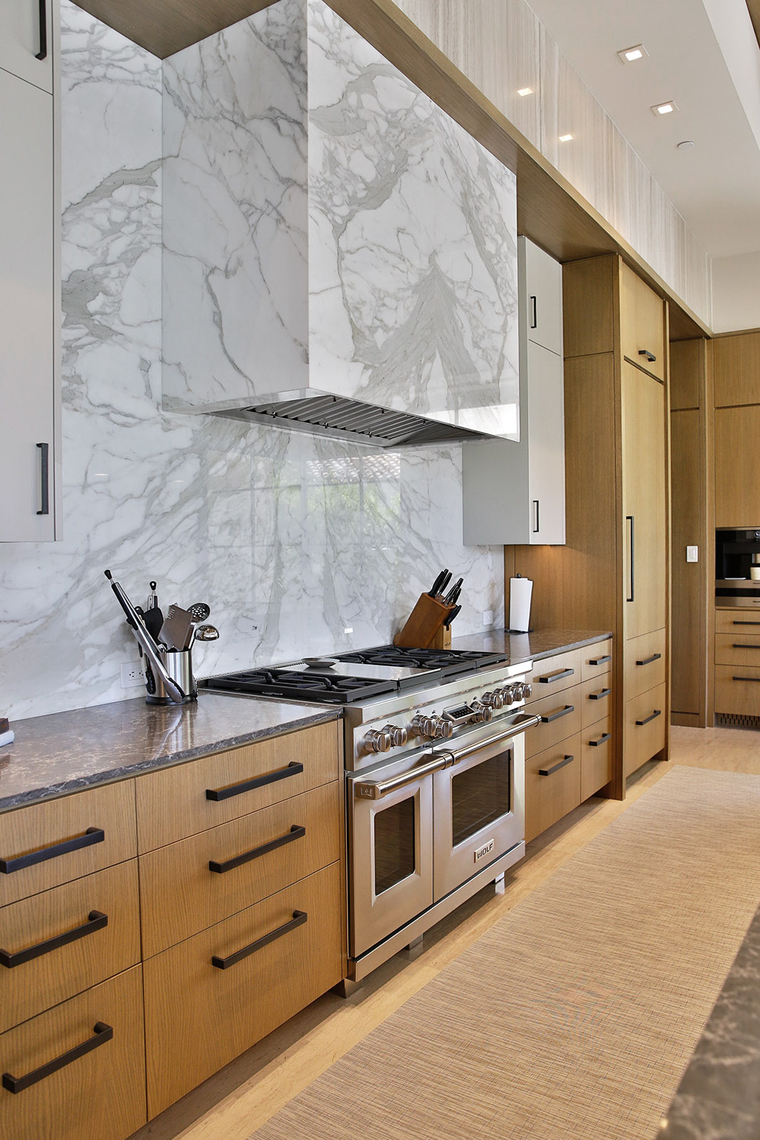 Calacatta Gold marble installed on kitchen wall and hood