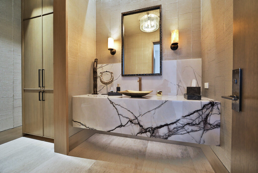 Lilac marble featured in modern bathroom with gold decor