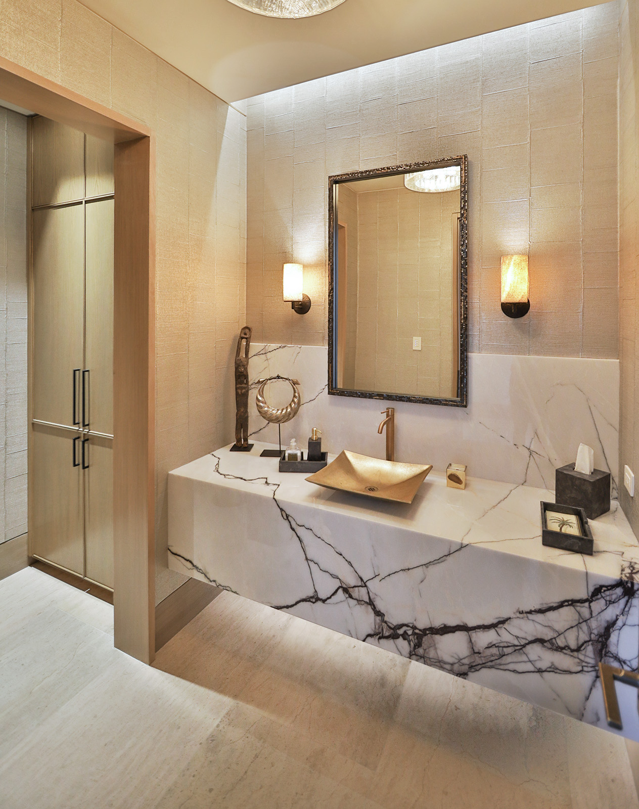 Lilac marble installed as bathroom vanity with gold walls