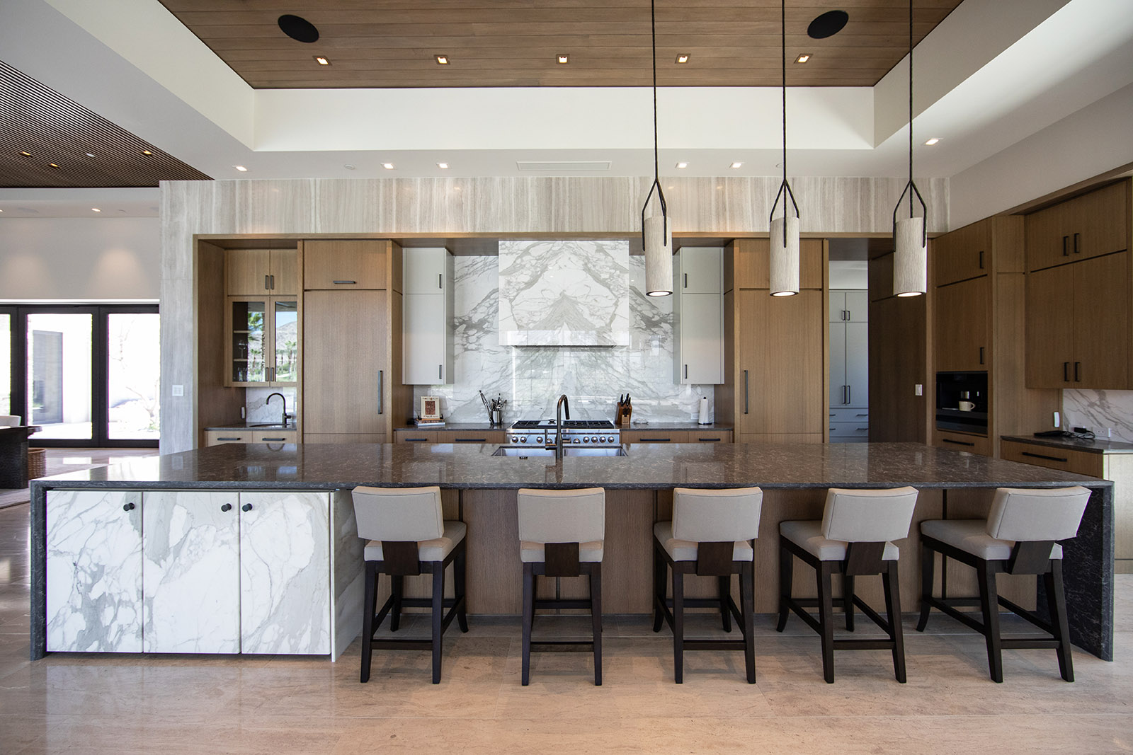 Calacatta Gold marble featured in kitchen with black quartz island