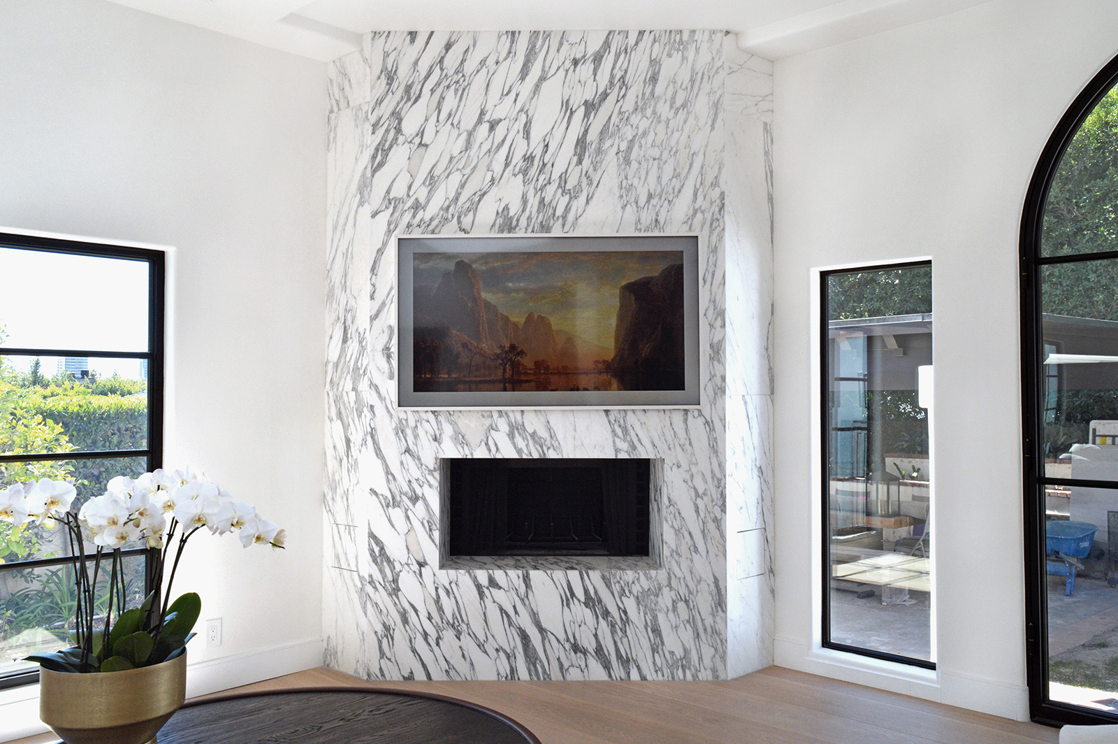 Arabescato Corchia marble featured on a fireplace in a modern home
