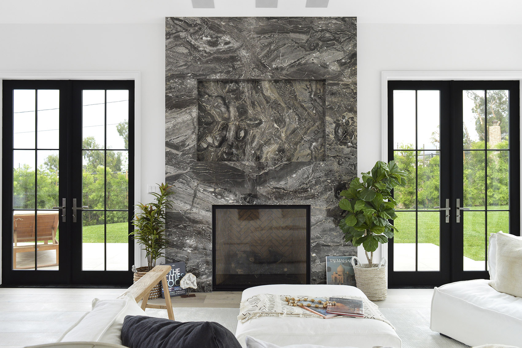 Arabescato Orobico Dark marble installed on fireplace in modern living room