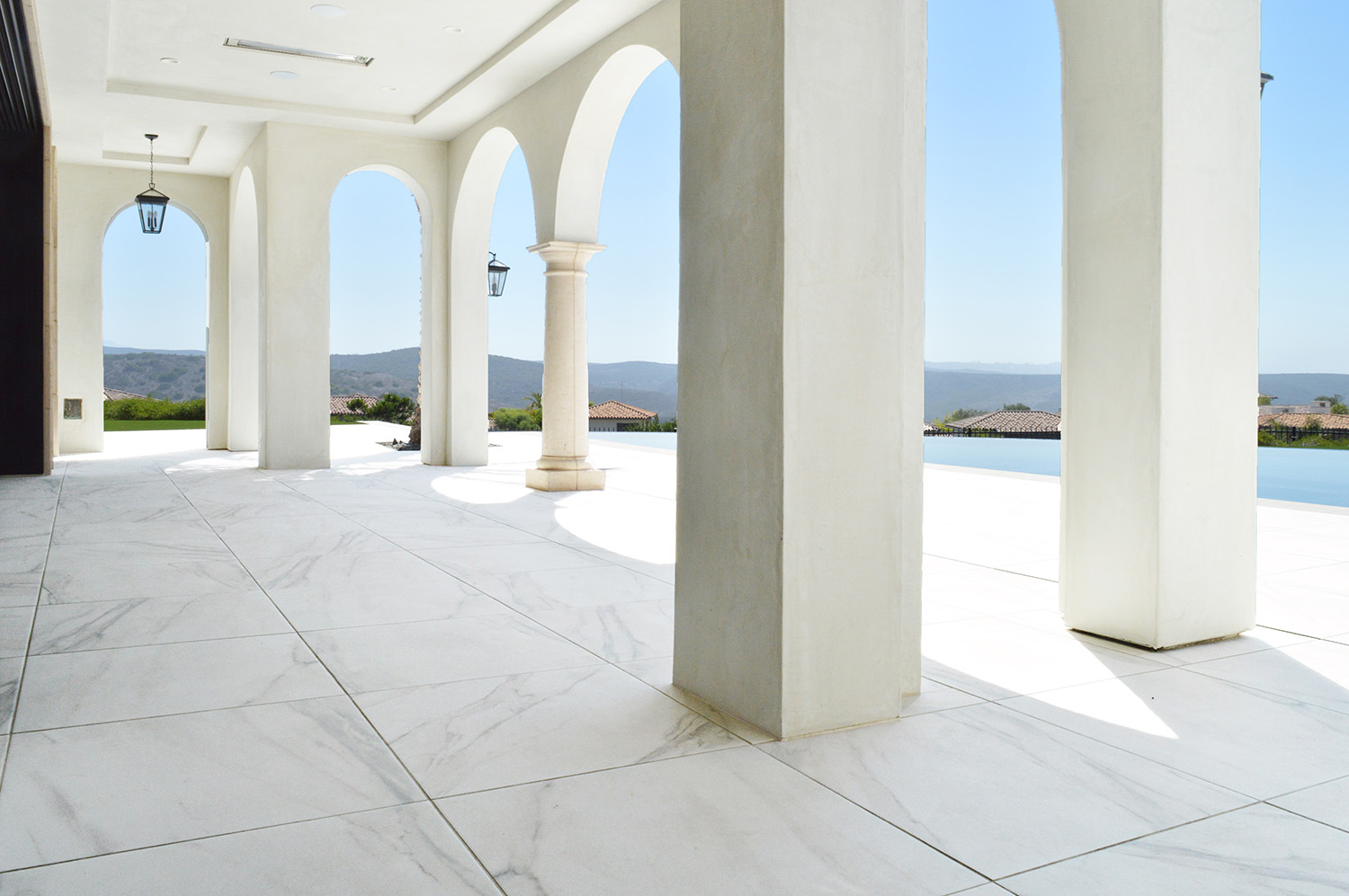Calacatta Gold porcelain pavers featured in exterior of modern home