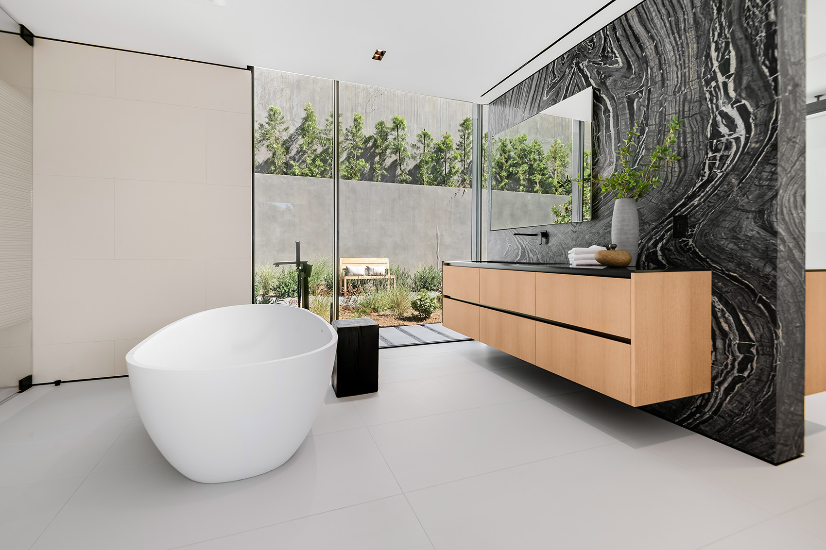 Silver Wave marble featured in bathroom with grey porcelain floors