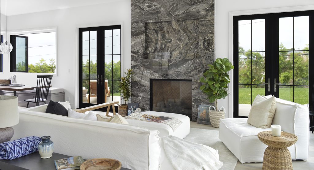 stone fireplace in modern white living room