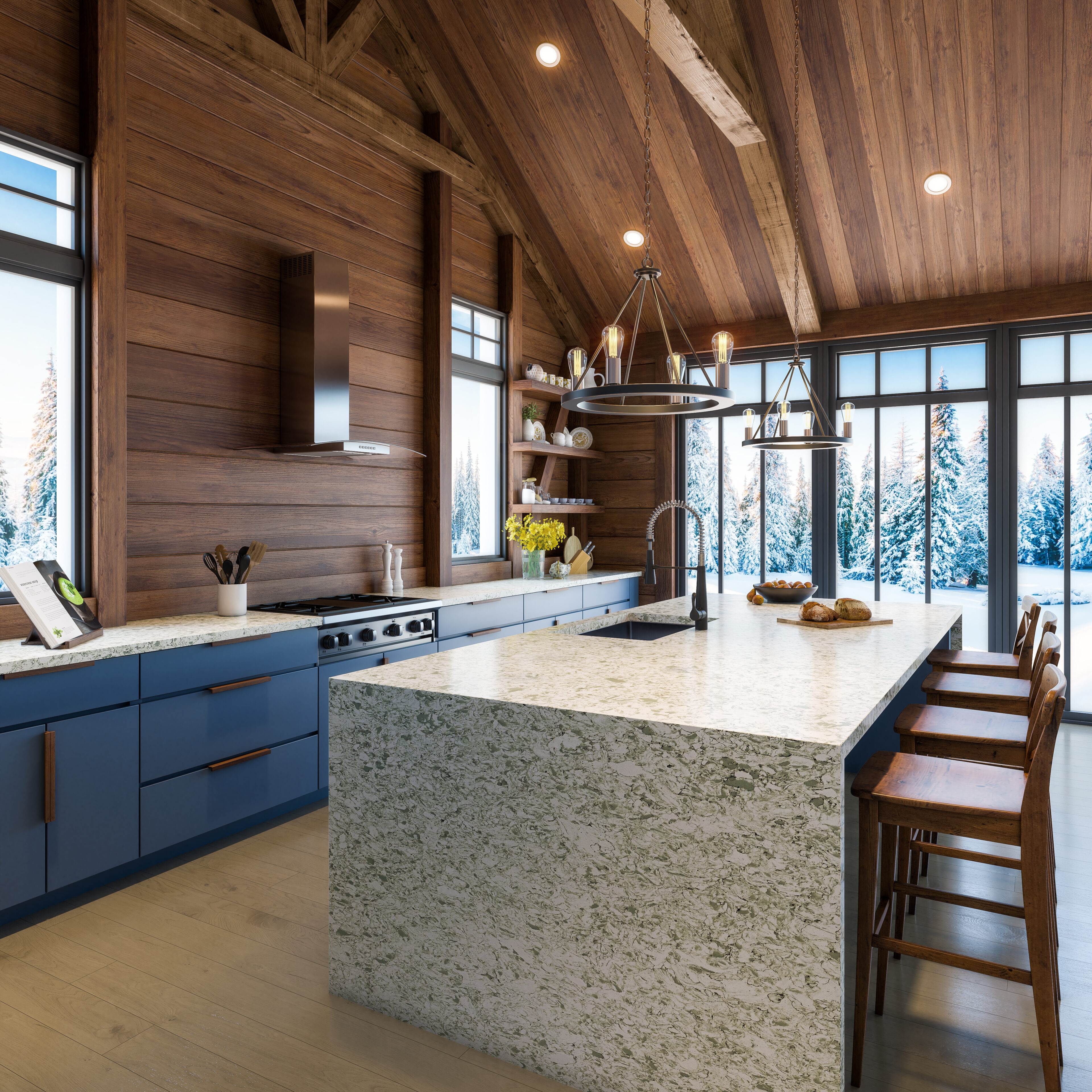 Metroquartz Celadon installed on island and counterops in luxury cabin. Snow covered trees in background. Blue cabinets and wood panelling.