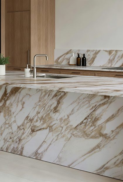 AuthTerra Calacatta Vagli Gold 9105 waterfall kitchen island and backsplash with oak cabinetry